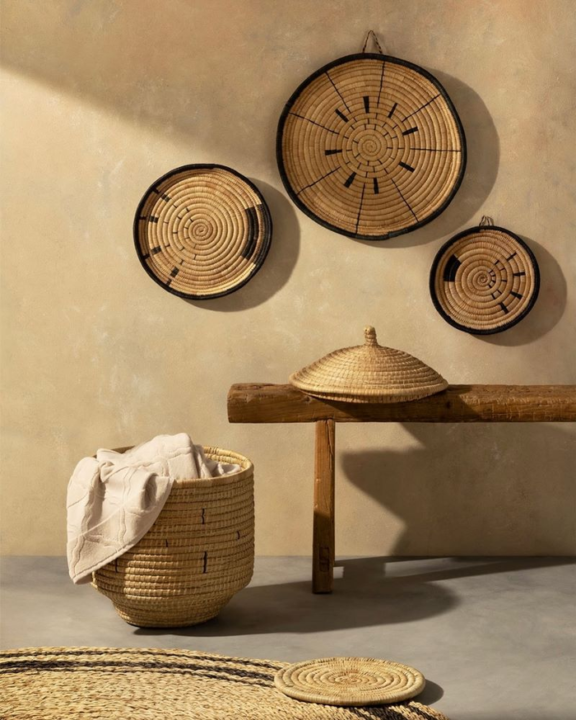 Decorative baskets from Mo's Crib, hanging on the wall, and one used as storage with linens