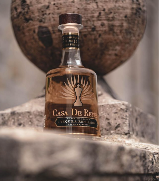 Casa de Reyes tequila, in a simple modern bottle with a king chess piece as the logo on the label