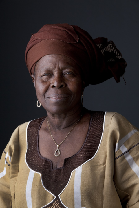 Portrait of Sophie Oluwole in headwrap and traditional attire