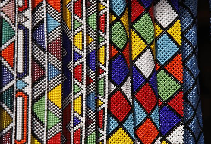 Colorful South African seed beads on a necklace or belt with geometric diamond patterns