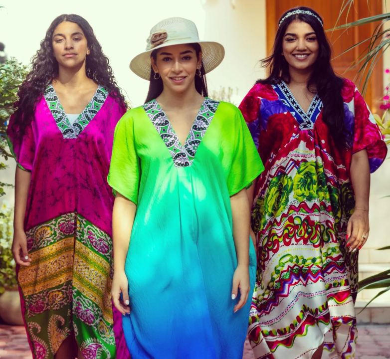 Women wearing colorful kaftans in a resort