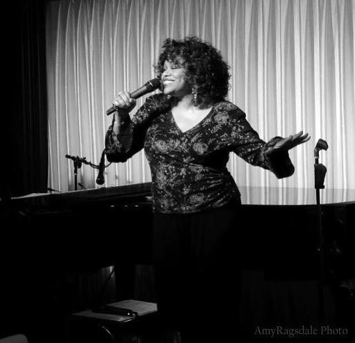 Singer Paula Jones performing at venue