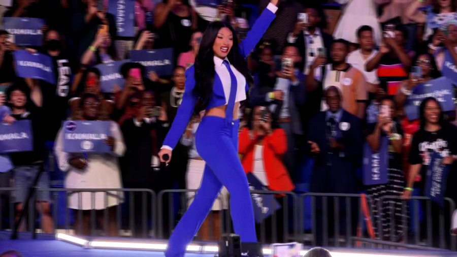 Megan thee Stallion in a bright blue suit showing support for Harris at Atlanta rally