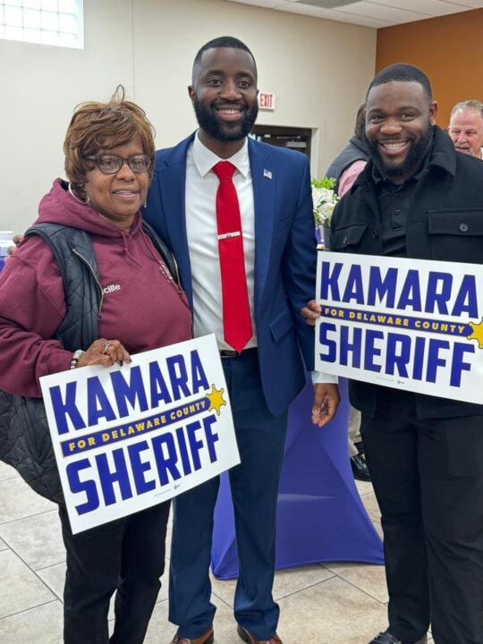 Siddiq Kamara with supporters holding signs that say "Kamara for Delaware County Sheriff"