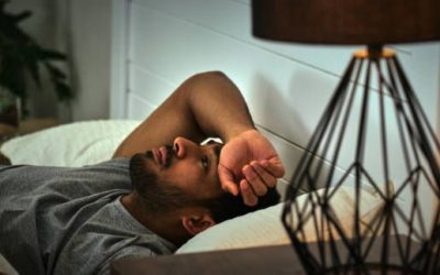 African American man sleeping in bed