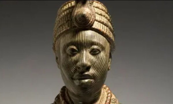 Olokun bronze head, a sculpture of a distinguished man in a headdress and necklaces