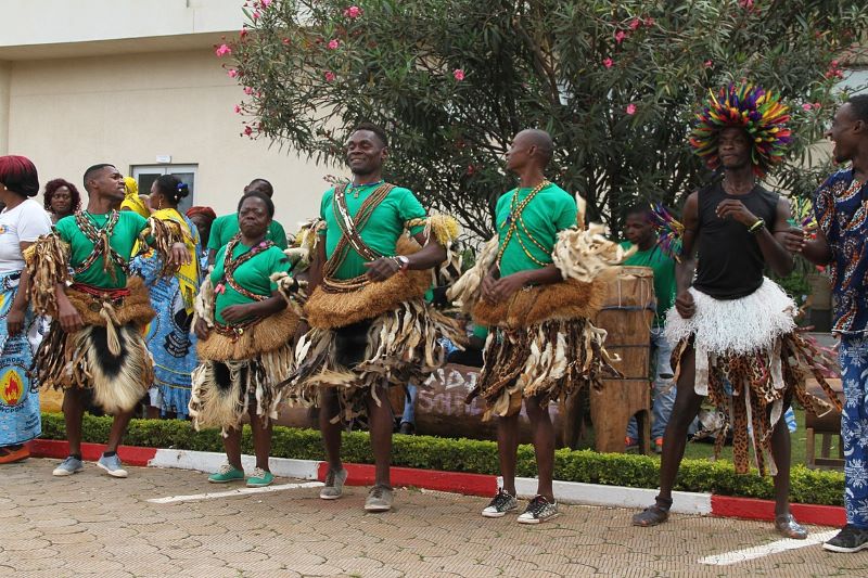 Dancers performing wearing detailed skirts and bead jewelry