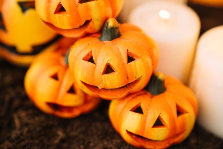 Small jack-o-lanterns next to candles