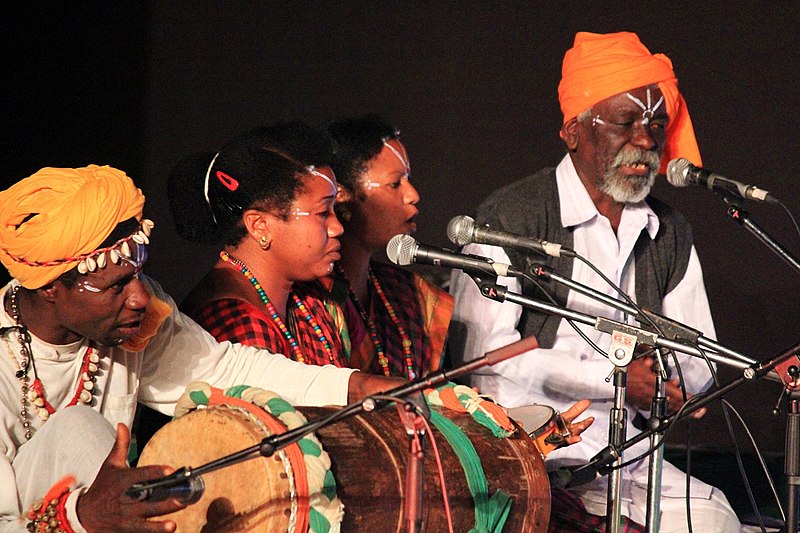 Siddi musicians singing and playing drums