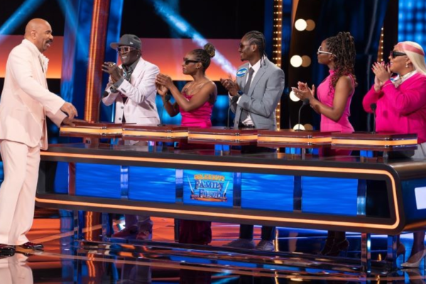 Steve Harvey with Flavor Flav and his family on Celebrity Family Feud