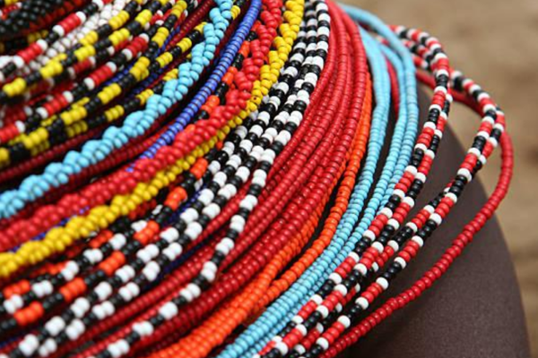 Colorful rows of beaded necklaces worn