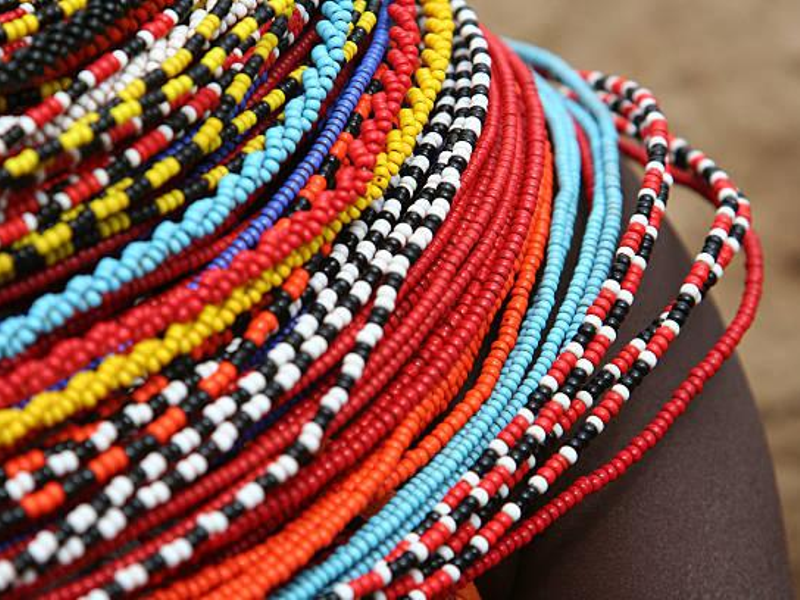 Colorful rows of beaded necklaces worn