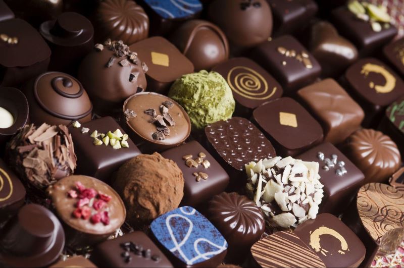 an array of chocolate truffles of various textures and toppings