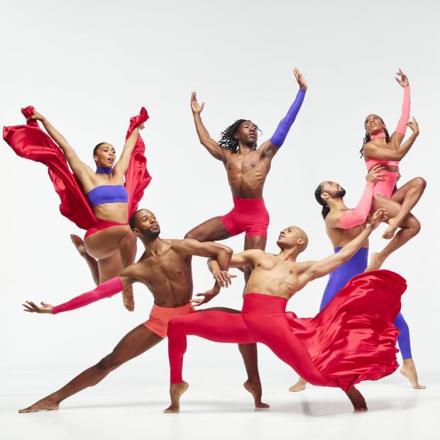 Six dancers in colorful costumes and dynamic poses