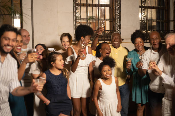 a group of family and friends of mixed races toasting to the new year