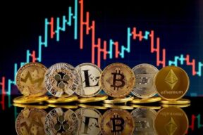 various cryptocurrency coins lined up in front of a stock chart