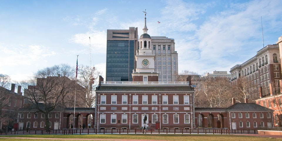 Independence Hall in Philadelphia, a colonial style brick building with a white clock tower