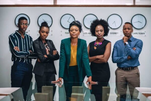 young black professionals standing in an office