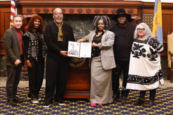 Vashti DuBois receiving an award from the city for the Colored Girls Museum at a formal reception. Also in the photo are councilmembers and city officials.