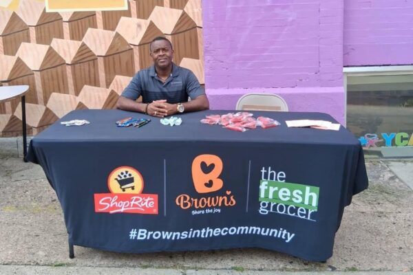 Stacey Dowling representing Brown's ShopRite at a table at a community event