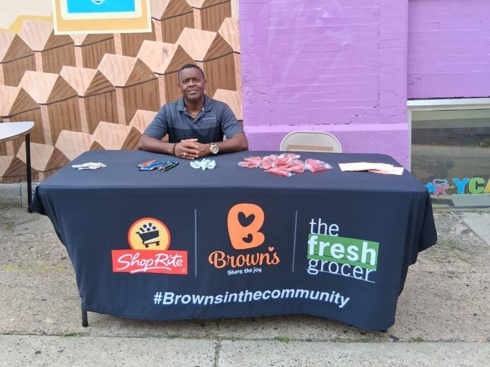 Stacey Dowling representing Brown's ShopRite at a table at a community event