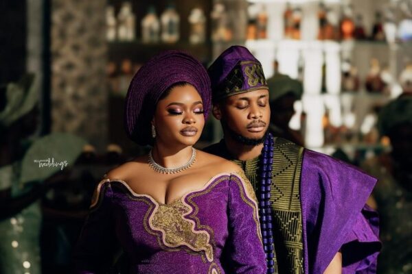 a Nigerian couple in luxurious wedding attire