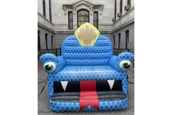 photo of inflatable chair with a dragon face on it