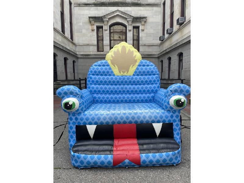 photo of inflatable chair with a dragon face on it