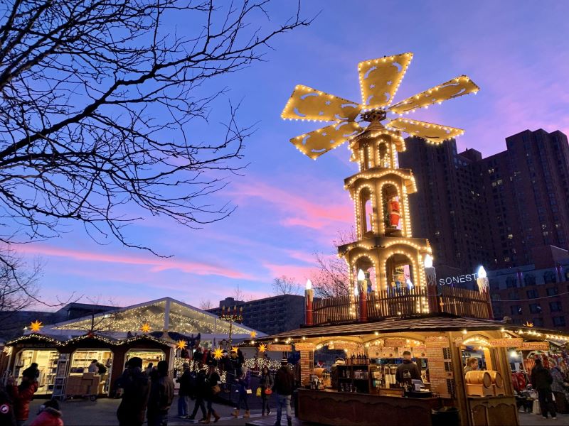 the 30 foot illuminated German Christmas tower, in shape of a windmill, against the Philadelphia sunset.