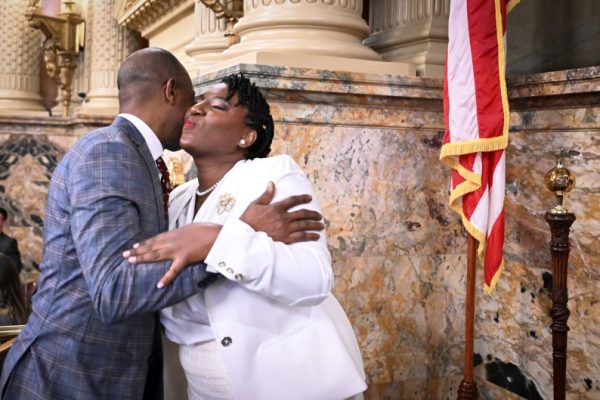 Dr. Eric Nzeribe and Speaker Joanna McClinton greeting each other with an embrace at the PA general assembly
