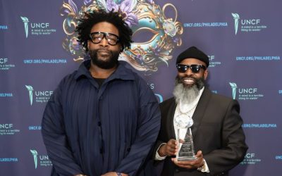 Ahmir “Questlove” Thompson and Tariq “Black Thought” Trotter of The Roots in front of backdrop at the Mayor's Ball Event for UNCF