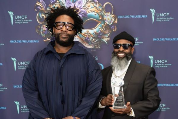 Ahmir “Questlove” Thompson and Tariq “Black Thought” Trotter of The Roots in front of backdrop at the Mayor's Ball Event for UNCF