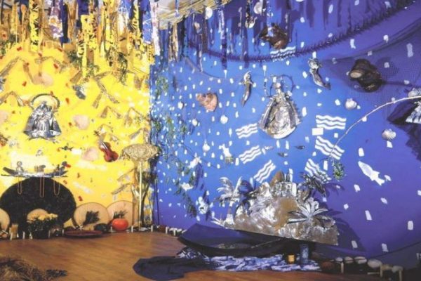 art installation taking up entire room with metallic foil details