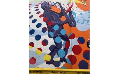 a mural of man playing saxophone