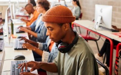 young African students working at computers in a classroom