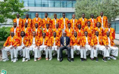 Cote d'Ivoire football team members, in matching suit jackets