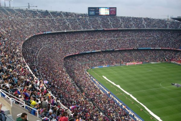 a packed football stadium with World Cup spectators