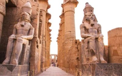ancient Egyptian temple with columns and seated statues
