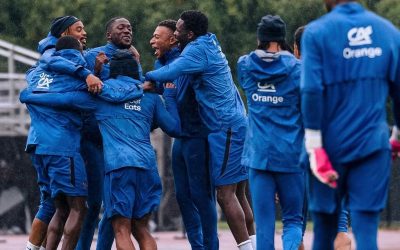 Kylian Mbappé of the France national team celebrating with teammates during a training session.