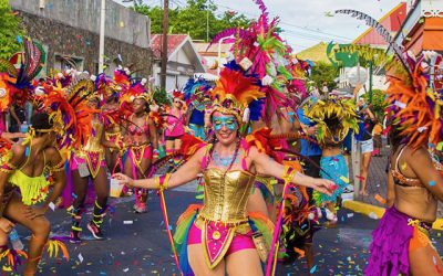 group of carnical dancers with headdresses and colorful outfits