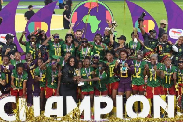Cameroon women's team wearing medals and celebrating their championship